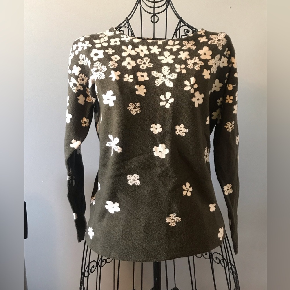 Green sweater with white flowers